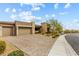 Beautiful single-story home features a three car garage and low maintenance desert landscaping at 10016 Copper Edge Rd, Las Vegas, NV 89148