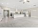 Bright, open kitchen with a large island, stainless steel appliances, and white cabinets at 10016 Copper Edge Rd, Las Vegas, NV 89148