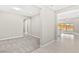Open-concept living space with neutral walls and carpet at 10016 Copper Edge Rd, Las Vegas, NV 89148