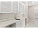 Mudroom with quartz countertops, stainless steel sink, and white cabinets at 10016 Copper Edge Rd, Las Vegas, NV 89148