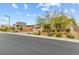 Modern home with desert landscaping and stone accents on a quiet street in a well-maintained community at 10016 Copper Edge Rd, Las Vegas, NV 89148