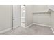 Walk-in closet providing ample storage space and featuring neutral carpeting and walls at 10016 Copper Edge Rd, Las Vegas, NV 89148