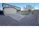 Spacious backyard featuring a large patio, gravel landscaping, and minimal lawn area at 10105 Prattville Ave, Las Vegas, NV 89148