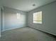 Neutral bedroom with carpet floors and window at 10105 Prattville Ave, Las Vegas, NV 89148