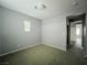 Cozy bedroom features neutral walls, carpet, and a single window providing natural light at 10105 Prattville Ave, Las Vegas, NV 89148