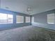 The primary bedroom has multiple windows allowing for ample natural light at 10105 Prattville Ave, Las Vegas, NV 89148