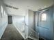 Upstairs hallway with decorative niche and carpet at 10105 Prattville Ave, Las Vegas, NV 89148