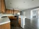 Bright kitchen with tile countertops, wood cabinetry, and stainless steel appliances at 10105 Prattville Ave, Las Vegas, NV 89148