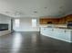 Spacious living area featuring dark wood laminate flooring and a cozy fireplace at 10105 Prattville Ave, Las Vegas, NV 89148