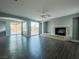 Spacious living room with fireplace and dark wood-look flooring at 10105 Prattville Ave, Las Vegas, NV 89148