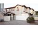 Inviting two-story home featuring a two-car garage and well-maintained landscaping at 10596 Corte Sierra St, Las Vegas, NV 89183