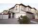 Charming two-story home featuring a two-car garage, desert landscaping, and a covered front entryway at 10596 Corte Sierra St, Las Vegas, NV 89183