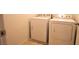 A laundry room with a white washer and dryer set, and neutral tile floors at 10596 Corte Sierra St, Las Vegas, NV 89183