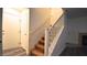 Carpeted staircase with white railing leading to the upper level at 10596 Corte Sierra St, Las Vegas, NV 89183