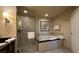 Elegant bathroom featuring a walk-in shower, soaking tub, and modern fixtures at 135 E Harmon Ave # 307, Las Vegas, NV 89109
