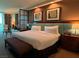 Well-appointed bedroom with a king bed, upholstered headboard, and stylish furnishings with bedside tables at 135 E Harmon Ave # 307, Las Vegas, NV 89109