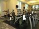 Bright gym with a variety of exercise equipment and large windows for natural light at 135 E Harmon Ave # 307, Las Vegas, NV 89109