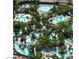 Aerial view of a lush outdoor pool area with winding pools and tropical landscaping at 135 E Harmon Ave # 307, Las Vegas, NV 89109