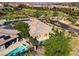 Wonderful aerial view of a home with a pool, spa, and outdoor living space at 15 Reflection Bay Dr, Henderson, NV 89011