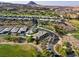 Beautiful aerial view of a home in a golf course community with picturesque mountain views at 15 Reflection Bay Dr, Henderson, NV 89011