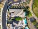 Bird's-eye view of a home with a luxurious backyard featuring a pool and meticulously landscaped grounds at 15 Reflection Bay Dr, Henderson, NV 89011