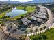 Stunning aerial view of a home on a golf course community with a picturesque lake at 15 Reflection Bay Dr, Henderson, NV 89011