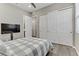 Bright bedroom showcasing closet space, ceiling fan and door to ensuite bath at 15 Reflection Bay Dr, Henderson, NV 89011