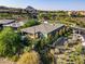 Aerial view showcasing the well-maintained home, lush landscaping, and inviting outdoor space at 15 Reflection Bay Dr, Henderson, NV 89011