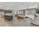 Bright open-concept living space with dining area, and a modern kitchen island at 15 Reflection Bay Dr, Henderson, NV 89011