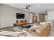 Spacious living room featuring stylish furnishings, a ceiling fan, and modern decor at 15 Reflection Bay Dr, Henderson, NV 89011