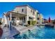 The backyard has a private pool, patio, pergola and desert landscaping at 1883 Nature Park Dr, North Las Vegas, NV 89084