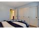 Bedroom with a closet and partial view of an adjacent bathroom at 1883 Nature Park Dr, North Las Vegas, NV 89084