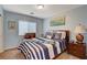 Nautical-themed bedroom features a comfortable bed and stylish decor at 1883 Nature Park Dr, North Las Vegas, NV 89084