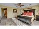 Yellow bedroom features a large bed, ceiling fan, and stylish accents at 1883 Nature Park Dr, North Las Vegas, NV 89084