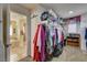 Walk-in closet with extensive storage solutions and door leading to bathroom at 1883 Nature Park Dr, North Las Vegas, NV 89084