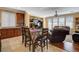 Cozy dining area with seating for six, connecting the kitchen and living spaces for easy entertaining at 1883 Nature Park Dr, North Las Vegas, NV 89084