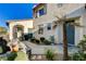 Inviting front entry with desert plants, a covered entryway, and a view of a private courtyard at 1883 Nature Park Dr, North Las Vegas, NV 89084