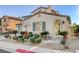 Charming single-Gathering home featuring desert landscaping, an arched entryway, and stylish accents at 1883 Nature Park Dr, North Las Vegas, NV 89084