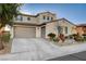 Beautiful two-story home with a two-car garage and well-maintained landscaping at 1883 Nature Park Dr, North Las Vegas, NV 89084