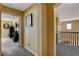 Hallway with carpet and access to other rooms in the house at 1883 Nature Park Dr, North Las Vegas, NV 89084