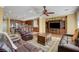 Spacious open-plan living room flowing into the kitchen with dark wood cabinets at 1883 Nature Park Dr, North Las Vegas, NV 89084