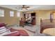 Comfortable upstairs living room with a ceiling fan, built-in shelving and staircase access at 1883 Nature Park Dr, North Las Vegas, NV 89084