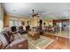 Bright and airy living room with multiple seating options and seamless flow to the dining area at 1883 Nature Park Dr, North Las Vegas, NV 89084