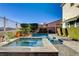 Beautiful pool and spa in a private backyard with mature landscaping at 1883 Nature Park Dr, North Las Vegas, NV 89084