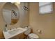 Stylish powder room featuring a pedestal sink, tasteful decor, and a well-lit ambiance at 1883 Nature Park Dr, North Las Vegas, NV 89084