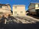 View of the backyard featuring a concrete patio and low maintenance desert landscaping at 2037 Houdini St, Henderson, NV 89002