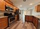 Well-equipped kitchen with stainless steel appliances, granite countertops, and wooden cabinetry at 2037 Houdini St, Henderson, NV 89002