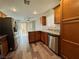 Bright kitchen featuring granite counters, stainless steel appliances, and wood-look flooring at 2037 Houdini St, Henderson, NV 89002