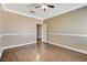 Spacious bedroom featuring hardwood floors, neutral walls, and decorative crown molding at 21 Bridal Falls Ct, Las Vegas, NV 89148