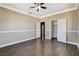 Bedroom featuring neutral colors, crown molding, wood-like floors, and two closets at 21 Bridal Falls Ct, Las Vegas, NV 89148